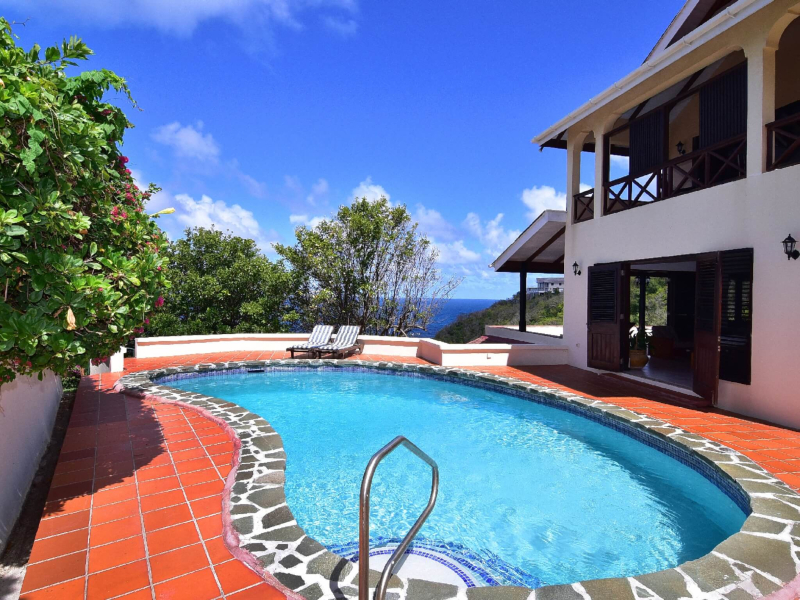 St. Lucia Real Estate Cliffside Oceanview Estate with swimming pool and chairs