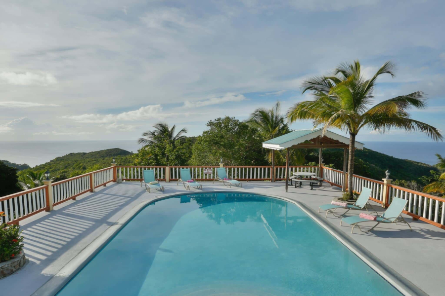 St. Lucia Real Estate Stunning West-Coast Residence in an Exclusive Sanctuary with pool chairs