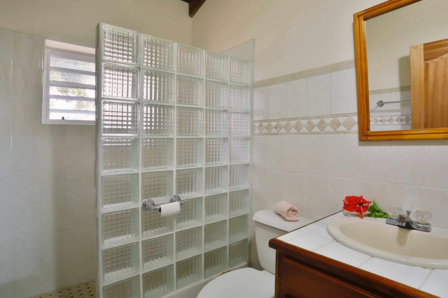 St. Lucia Real Estate Stunning West-Coast Residence in an Exclusive Sanctuary with mirrors in bathroom